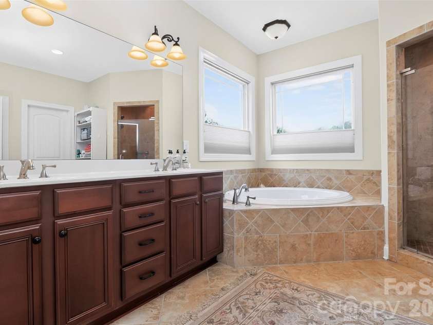 154 Ramano Drive, Iron Station, NC 28080.  MLS# CAR4411067, YatesRealty ID 41853. Primary Bath dual sinks