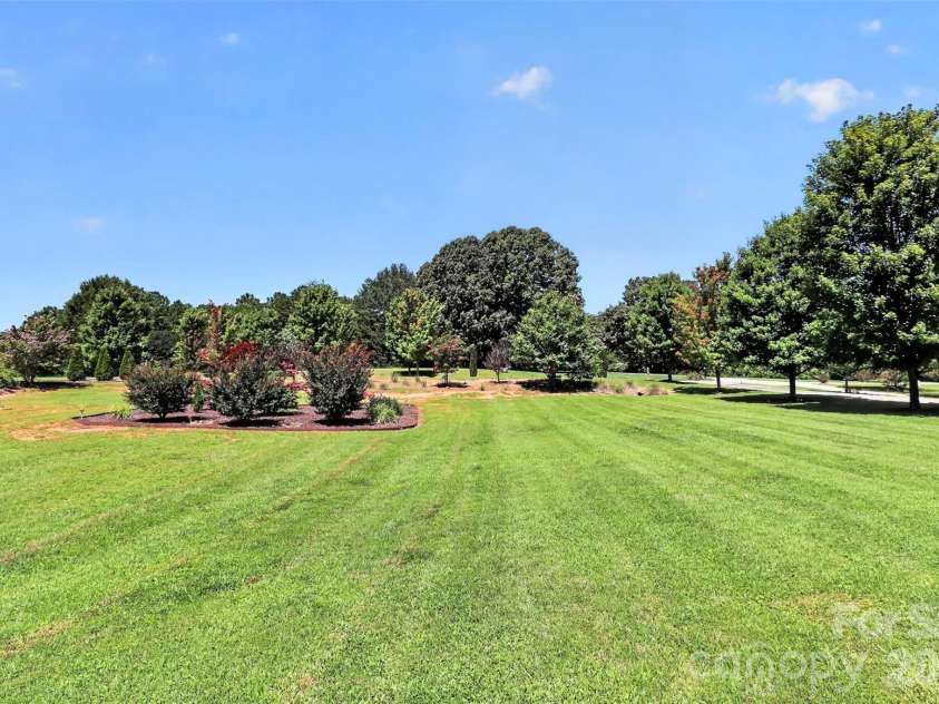 154 Ramano Drive, Iron Station, NC 28080.  MLS# CAR4411067, YatesRealty ID 41853. View from front porch