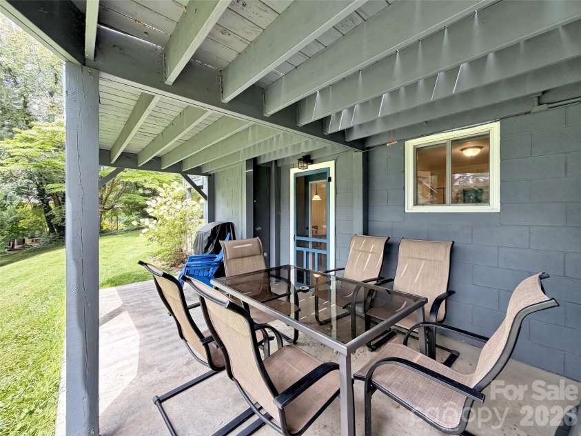 87 Glenview Road, Lake Junaluska, NC 28745.  MLS# CAR4411765, YatesRealty ID 41862. Lower patio