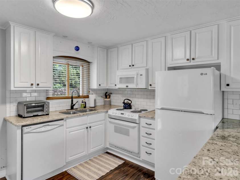 87 Glenview Road, Lake Junaluska, NC 28745.  MLS# CAR4411765, YatesRealty ID 41862. Upper updated Kitchen - Light & Bright