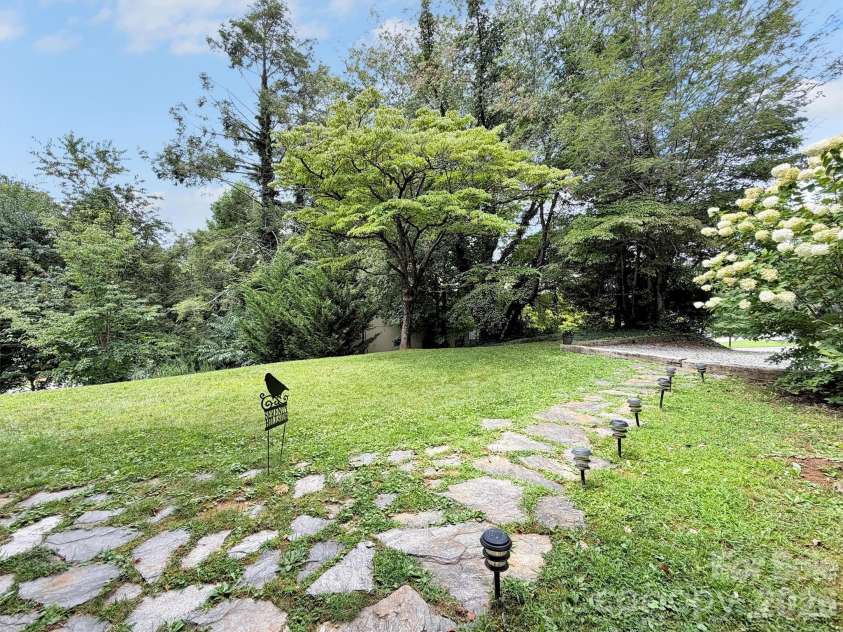 87 Glenview Road, Lake Junaluska, NC 28745.  MLS# CAR4411765, YatesRealty ID 41862. Walkway to lower unit
