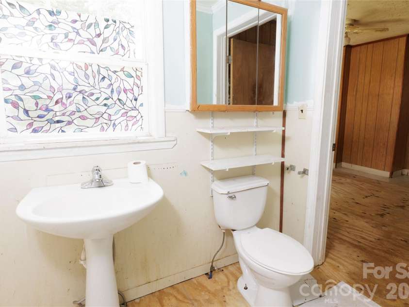 329 Finley Avenue, Lenoir, NC 28645.  MLS# CAR4409548, YatesRealty ID 41864. Full bath from kitchen looking into primary bedroom