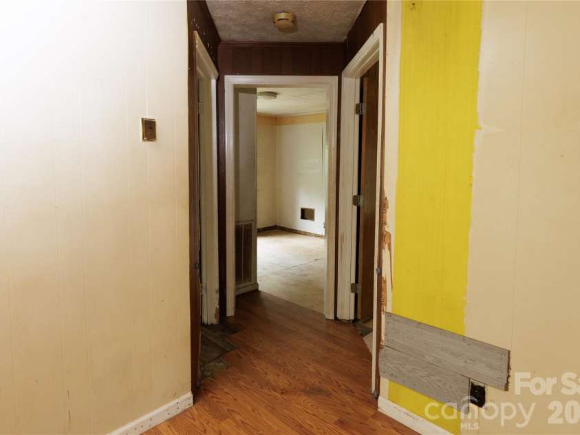 329 Finley Avenue, Lenoir, NC 28645.  MLS# CAR4409548, YatesRealty ID 41864. Hall leading to kitchen and flex room area