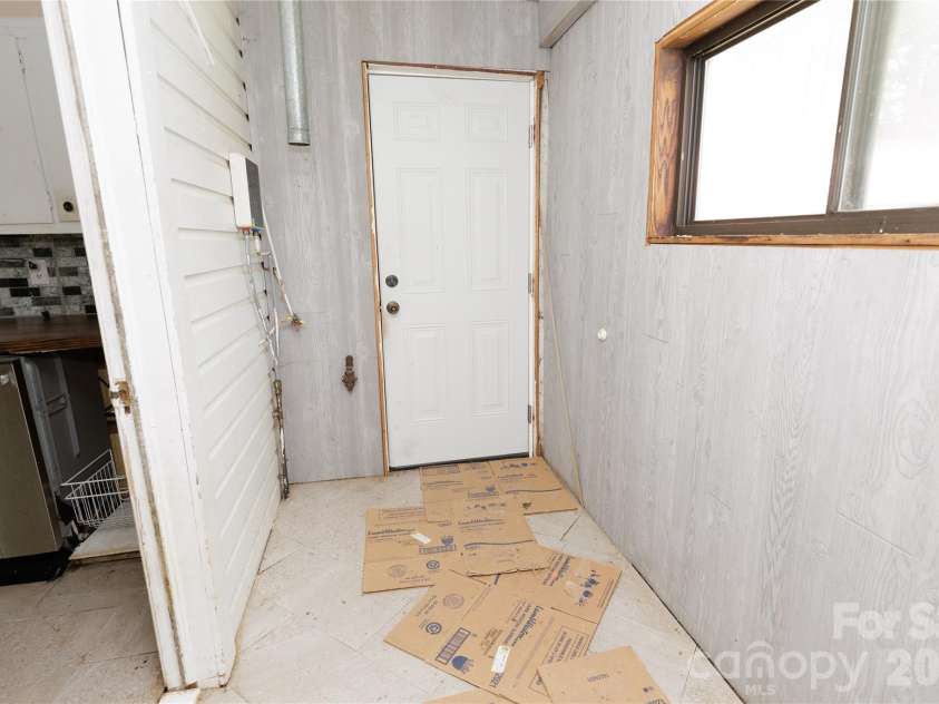 329 Finley Avenue, Lenoir, NC 28645.  MLS# CAR4409548, YatesRealty ID 41864. Mudroom/laundry area, leading into kitchen