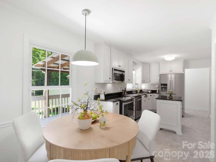 110 Sawtooth Lane, Stanley, NC 28164.  MLS# CAR4409490, YatesRealty ID 41865. Breakfast area in the kitchen overlooking the large back deck
