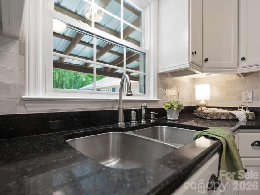 110 Sawtooth Lane, Stanley, NC 28164.  MLS# CAR4409490, YatesRealty ID 41865. Window in the kitchen overlooking the large back deck