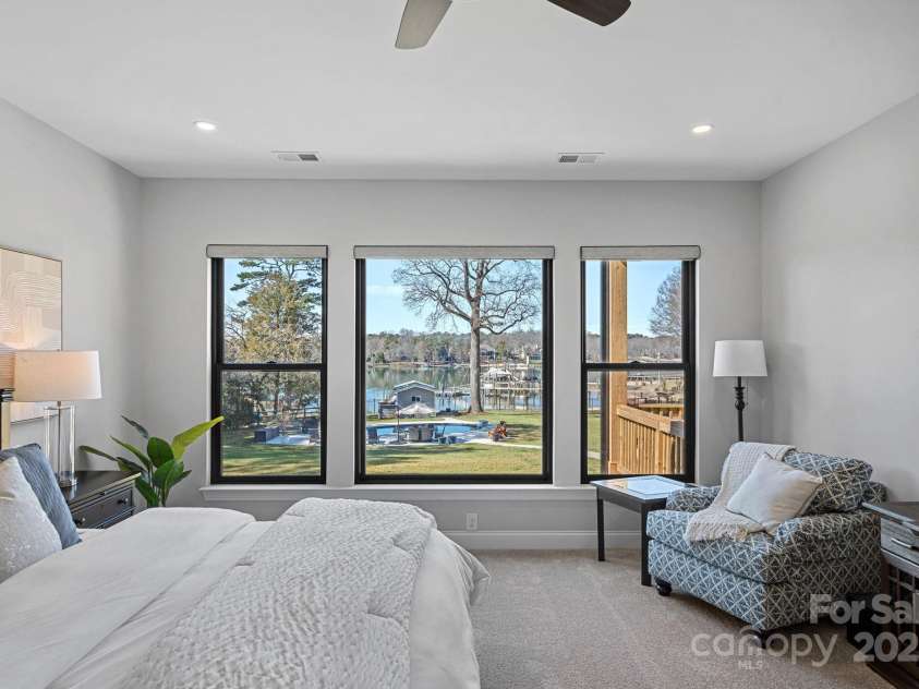 106 Beachview Drive, Mooresville, NC 28117.  MLS# CAR4228983, YatesRealty ID 4189. Bright and airy primary that overlooks the lake