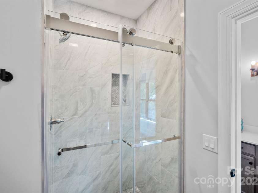 106 Beachview Drive, Mooresville, NC 28117.  MLS# CAR4228983, YatesRealty ID 4189. Custom tile in secondary bath