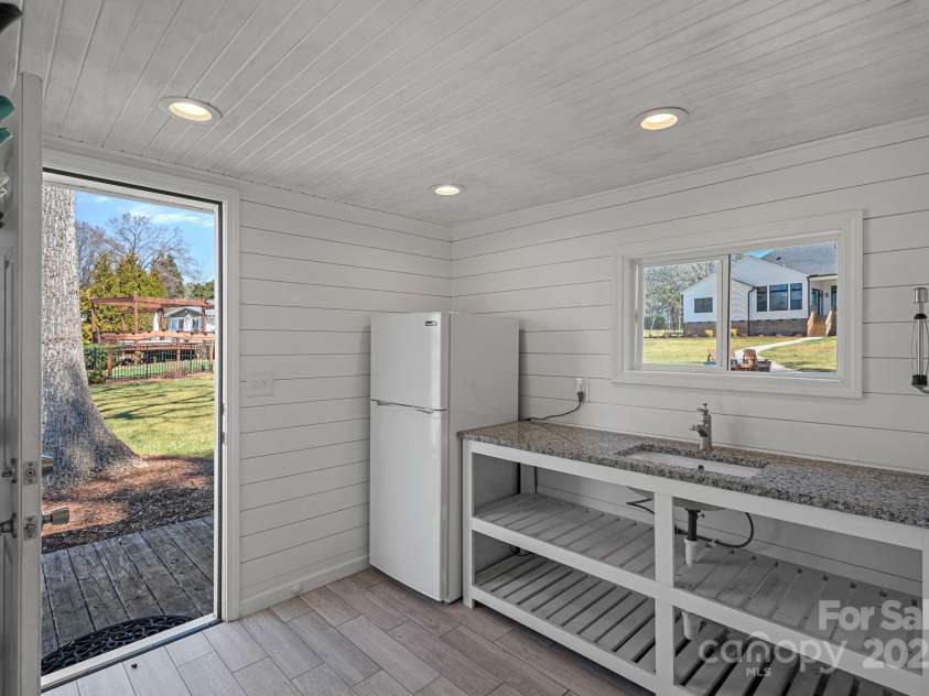106 Beachview Drive, Mooresville, NC 28117.  MLS# CAR4228983, YatesRealty ID 4189. Pool House Bathroom and Sink