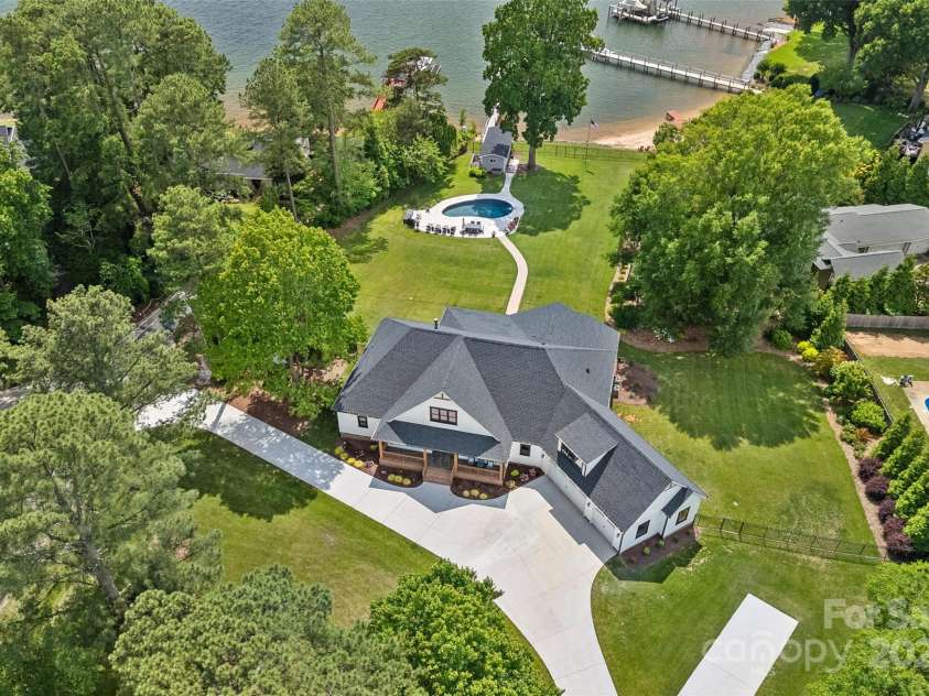 106 Beachview Drive, Mooresville, NC 28117.  MLS# CAR4228983, YatesRealty ID 4189. Your own 1.5 Acre Oasis on Lake Norman