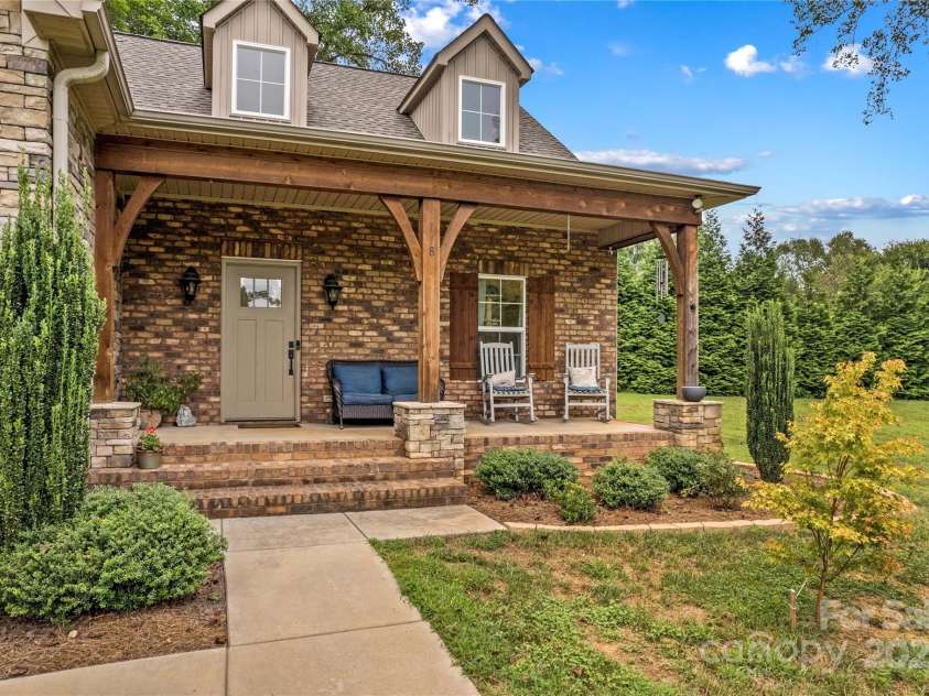 178 Nellwood Court, Mocksville, NC 27028.  MLS# CAR4301182, YatesRealty ID 419. Invite your guests to join you on the front porch.