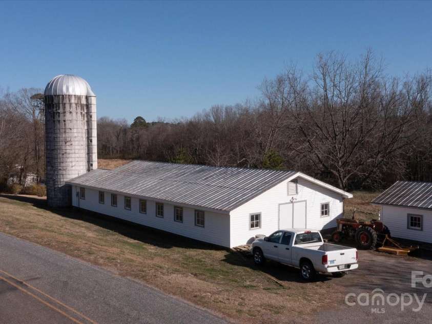 732 Crowe Dairy Road, Forest City, NC 28043.  MLS# CAR4234052, YatesRealty ID 419. 40 foot silo in great condition, plus retail building and over-sized workshop.