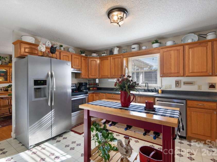 732 Crowe Dairy Road, Forest City, NC 28043.  MLS# CAR4234052, YatesRealty ID 419. Main level kitchen with open floor plan.