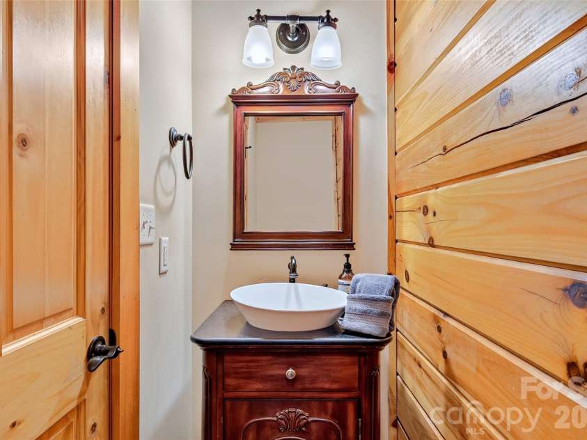 1767 Catawba Falls Parkway, Black Mountain, NC 28711.  MLS# CAR4411768, YatesRealty ID 41900. Main level half bath