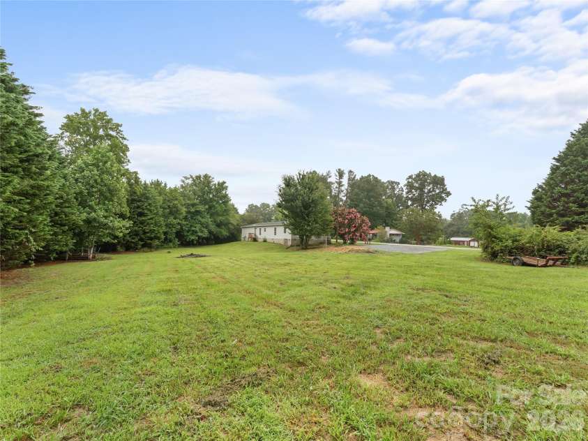 398 Staton Road, Flat Rock, NC 28731.  MLS# CAR4404515, YatesRealty ID 41912. Back yard