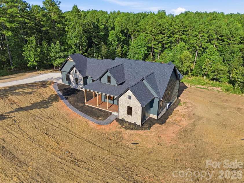 5529 Paddock Way, Granite Falls, NC 28630.  MLS# CAR4404325, YatesRealty ID 41913. Wooded Backyard