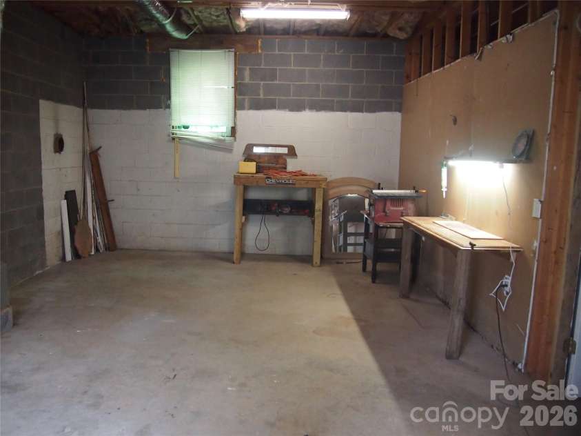 5164 Ralph Winchester Road, Lenoir, NC 28645.  MLS# CAR4346503, YatesRealty ID 41920. Downstairs Workspace