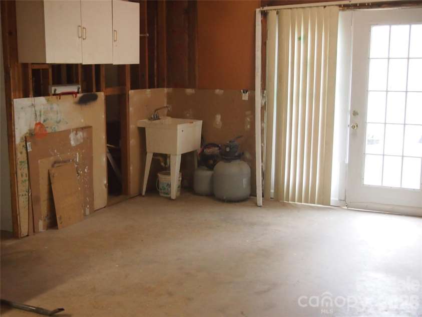 5164 Ralph Winchester Road, Lenoir, NC 28645.  MLS# CAR4346503, YatesRealty ID 41920. Downstairs workspace view 2