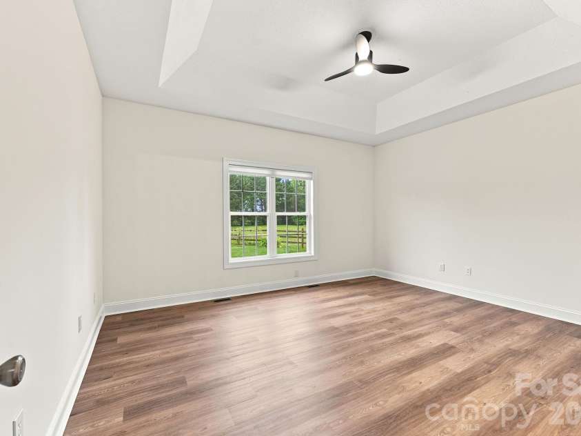150 Evening Drive, Salisbury, NC 28147.  MLS# CAR4408691, YatesRealty ID 41929. Trey ceiling in the primary -chair railing