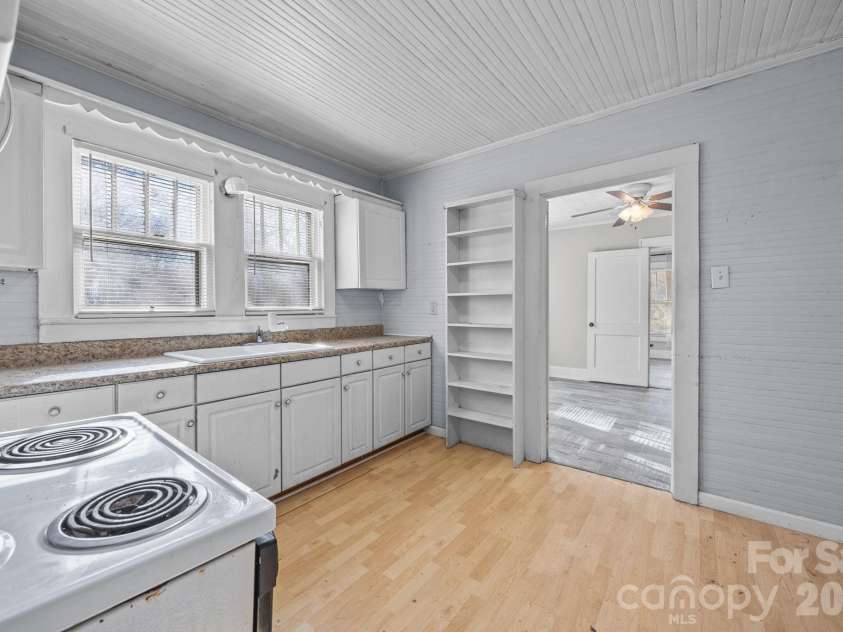 815 Desoto Avenue, Kannapolis, NC 28083.  MLS# CAR4335383, YatesRealty ID 4193. Apt B Kitchen with range, microwave & refrigerator