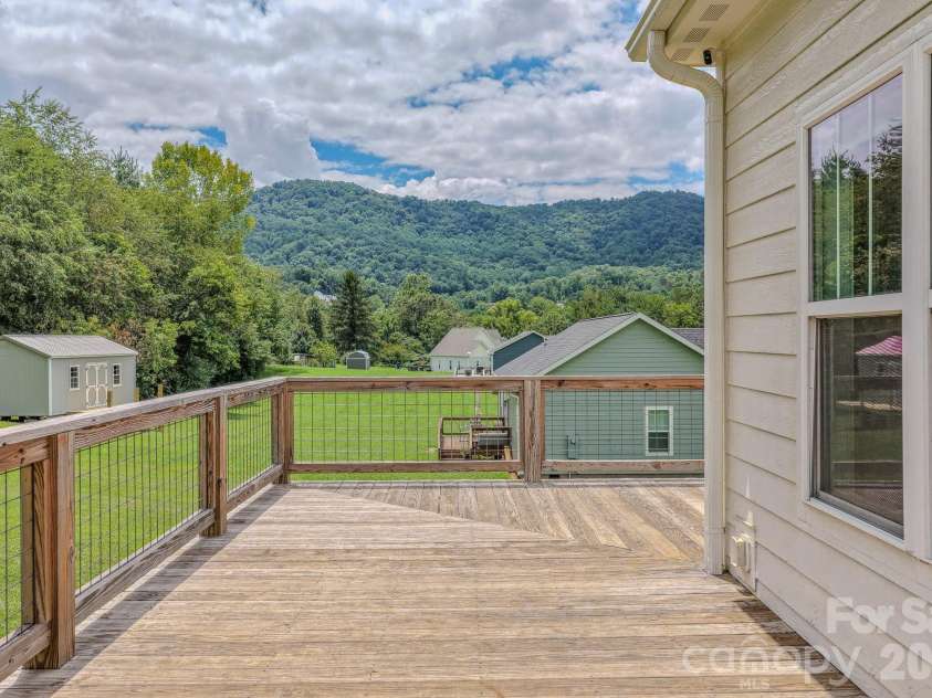 160 Ridge View Drive, Clyde, NC 28721.  MLS# CAR4411209, YatesRealty ID 41946. Back porch with view