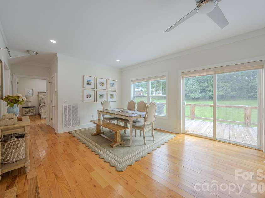 160 Ridge View Drive, Clyde, NC 28721.  MLS# CAR4411209, YatesRealty ID 41946. Dining room with primary bedroom in view