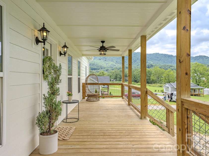 160 Ridge View Drive, Clyde, NC 28721.  MLS# CAR4411209, YatesRealty ID 41946. Front porch with long range views