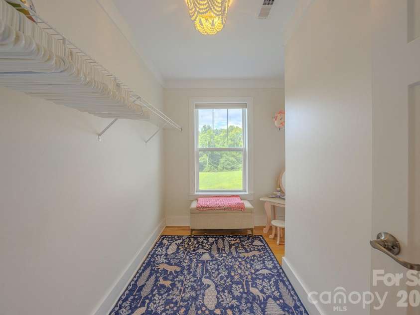160 Ridge View Drive, Clyde, NC 28721.  MLS# CAR4411209, YatesRealty ID 41946. Large closet with natural light in second primary bedroom