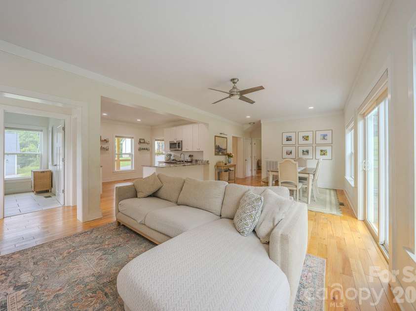160 Ridge View Drive, Clyde, NC 28721.  MLS# CAR4411209, YatesRealty ID 41946. Living room, dining room and kitchen