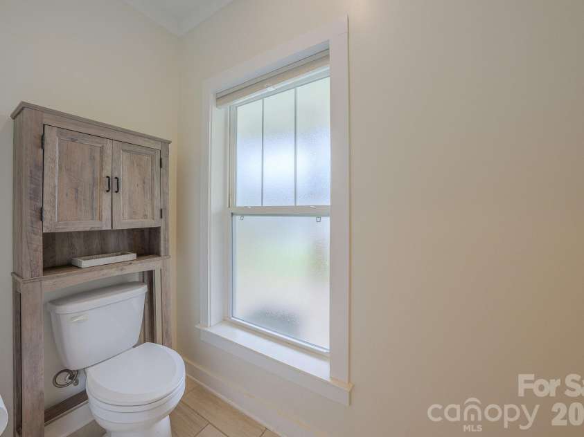 160 Ridge View Drive, Clyde, NC 28721.  MLS# CAR4411209, YatesRealty ID 41946. Primary bathroom toilet closet