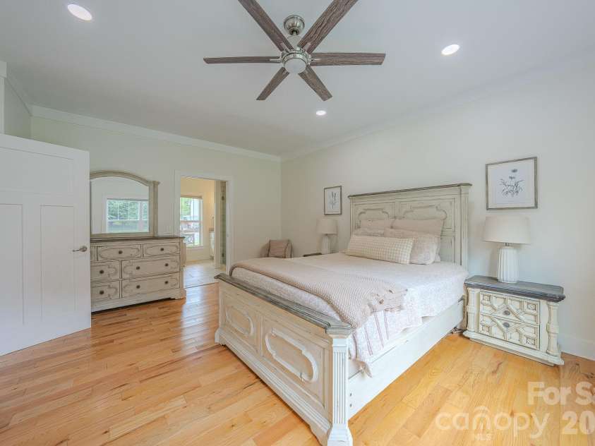 160 Ridge View Drive, Clyde, NC 28721.  MLS# CAR4411209, YatesRealty ID 41946. Primary bedroom and  bathroom