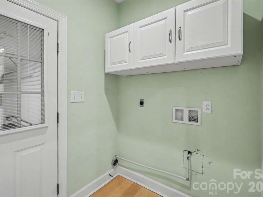 128 Columns Circle, Shelby, NC 28150.  MLS# CAR4395248, YatesRealty ID 41954. Cabinets over the washer/dryer area