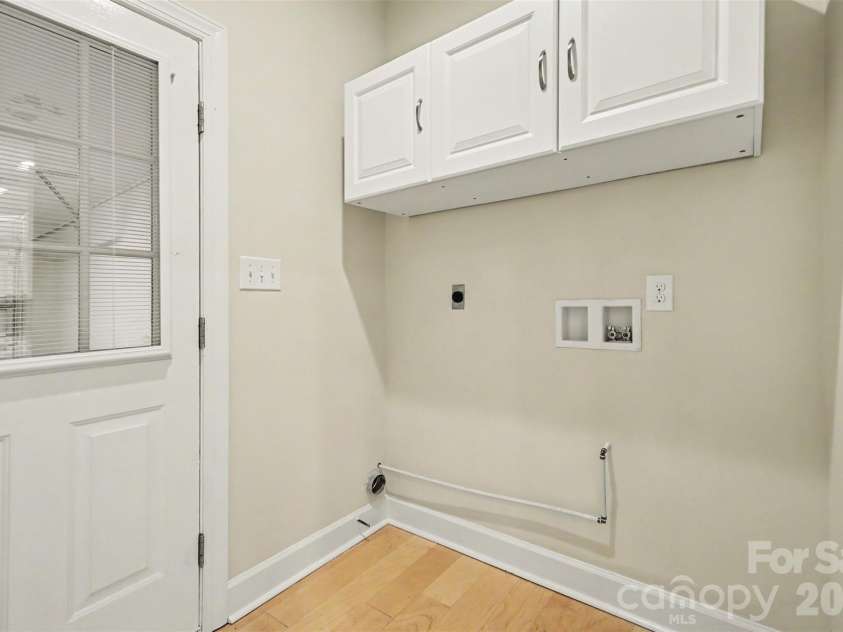 128 Columns Circle, Shelby, NC 28150.  MLS# CAR4395248, YatesRealty ID 41954. Cabinets over the washer/dryer area