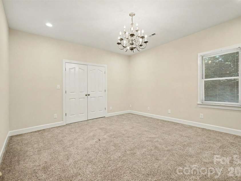 128 Columns Circle, Shelby, NC 28150.  MLS# CAR4395248, YatesRealty ID 41954. There is neutral paint and carpet in both downstairs bedrooms.