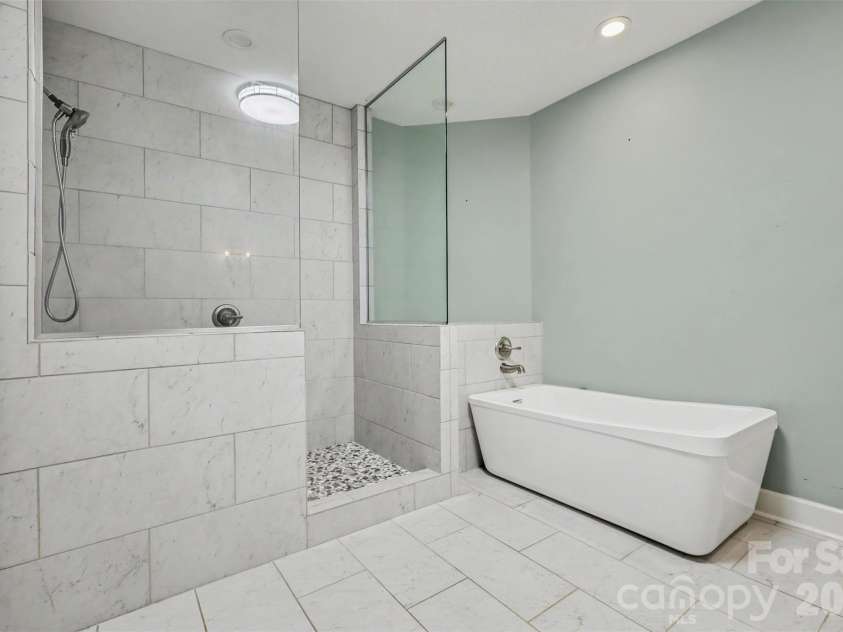 128 Columns Circle, Shelby, NC 28150.  MLS# CAR4395248, YatesRealty ID 41954. This is the HUGE updated primary bath with tiled, walk-in shower, soaking tub,...