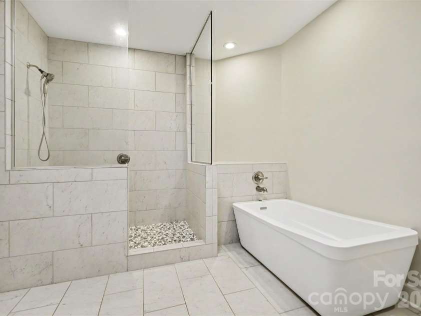 128 Columns Circle, Shelby, NC 28150.  MLS# CAR4395248, YatesRealty ID 41954. This is the HUGE updated primary bath with tiled, walk-in shower, soaking tub,...