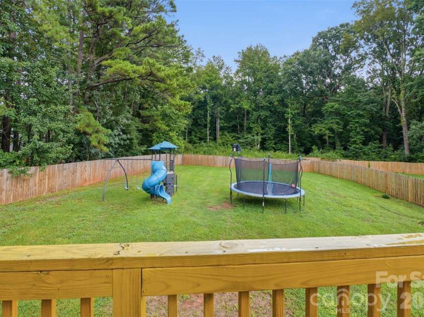 1981 Ripplerock Road, Fort Mill, SC 29715.  MLS# CAR4410148, YatesRealty ID 41974. Fully fenced back yard