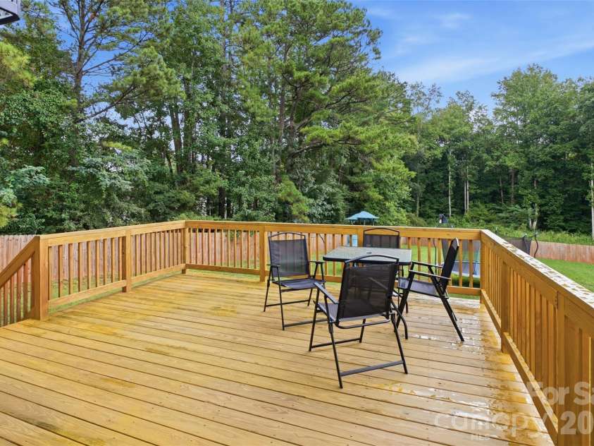 1981 Ripplerock Road, Fort Mill, SC 29715.  MLS# CAR4410148, YatesRealty ID 41974. Large deck overlooking expansive back yard