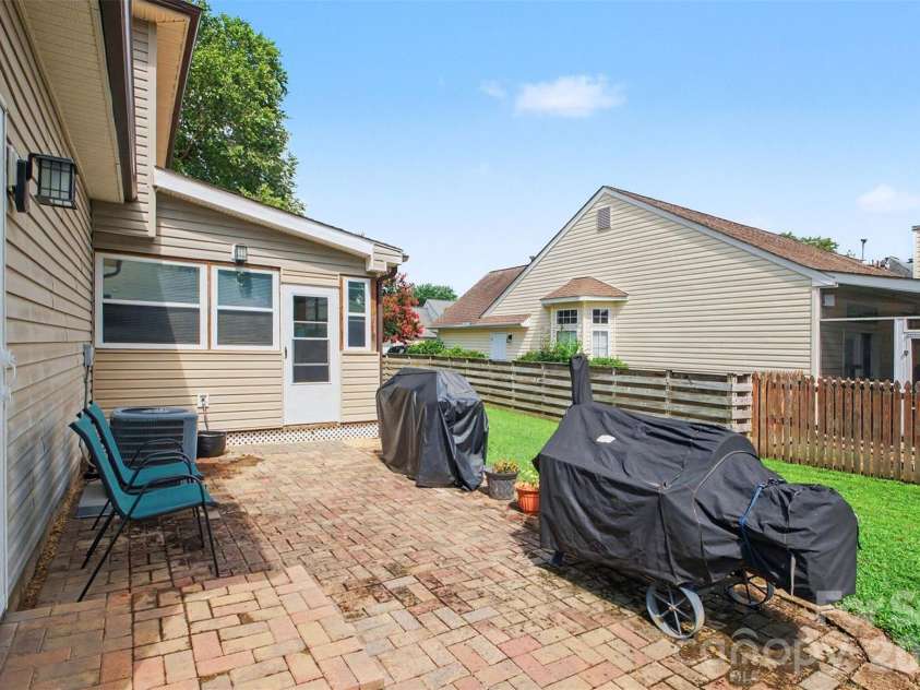 4828 Asherton Place, Concord, NC 28027.  MLS# CAR4411724, YatesRealty ID 41978. Back Patio