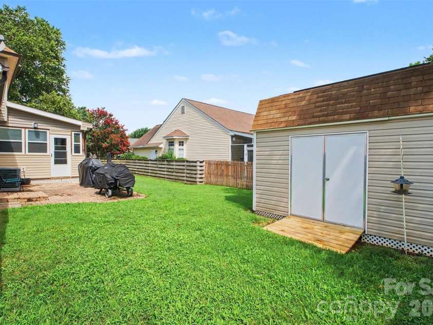 4828 Asherton Place, Concord, NC 28027.  MLS# CAR4411724, YatesRealty ID 41978. Shed