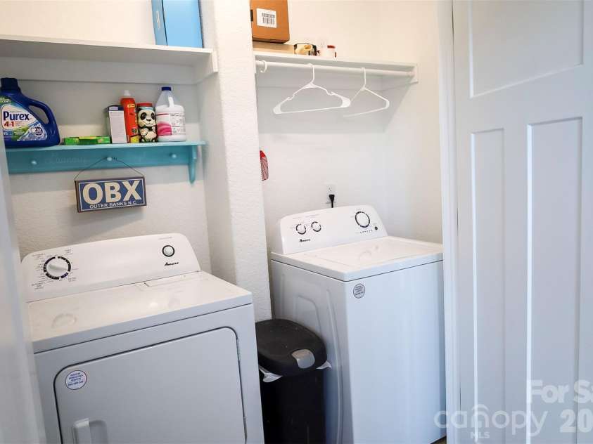 121 Meadow Ridge Lane, Coinjock, NC 27923.  MLS# CAR4337553, YatesRealty ID 4200. Laundry off the dining room