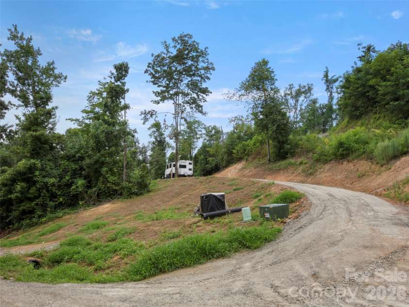 213 Three Rivers Drive, Hendersonville, NC 28792.  MLS# CAR4412069, YatesRealty ID 42006. Temporary trailer to be removed from lot 1