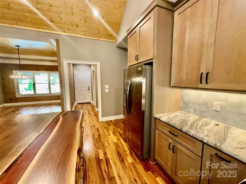 230 Catatoga Path, Brevard, NC 28712.  MLS# CAR4311178, YatesRealty ID 4201. Kitchen to Mud Room