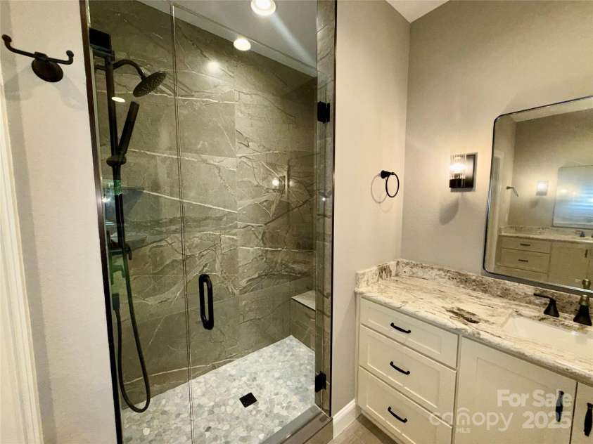 230 Catatoga Path, Brevard, NC 28712.  MLS# CAR4311178, YatesRealty ID 4201. Vanity and Stunning Shower