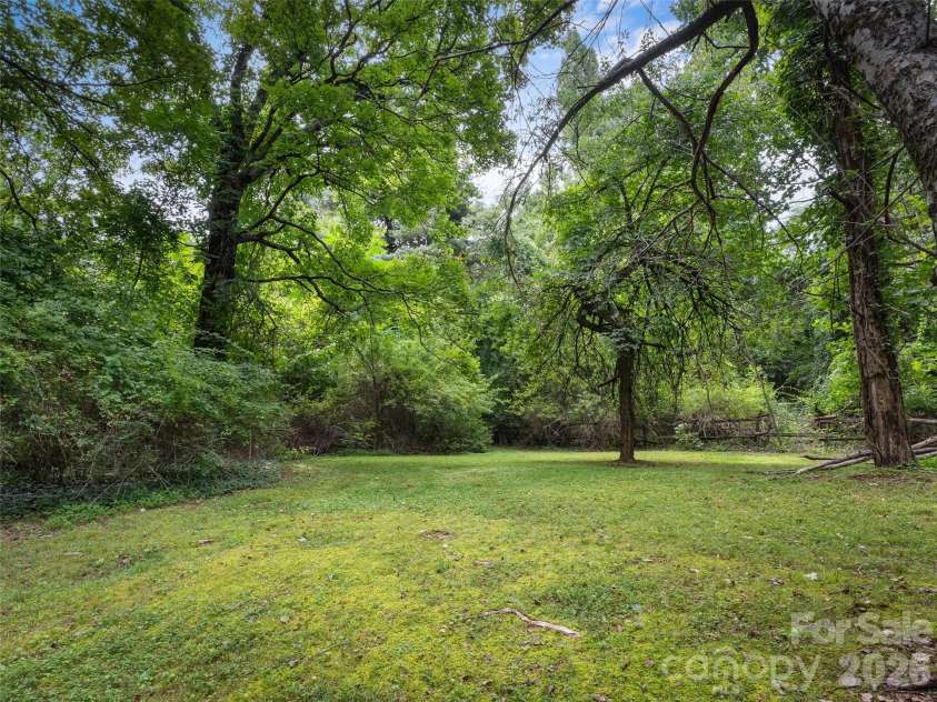 95 Substation Road, Saluda, NC 28773.  MLS# CAR4402765, YatesRealty ID 42020. Back yard