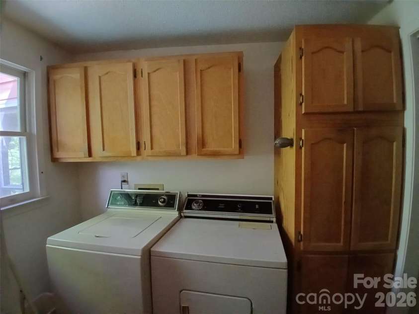 95 Substation Road, Saluda, NC 28773.  MLS# CAR4402765, YatesRealty ID 42020. Laundry area