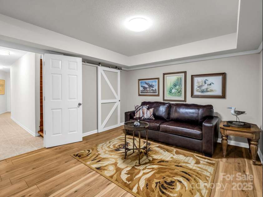 193 Downing Place, Lake Lure, NC 28746.  MLS# CAR4280208, YatesRealty ID 4203. Expansive space in the finished walk-out basement flex room.