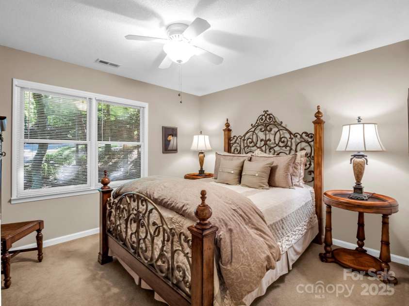 193 Downing Place, Lake Lure, NC 28746.  MLS# CAR4280208, YatesRealty ID 4203. Guest bedroom on the main level with adjoining guest bathroom.