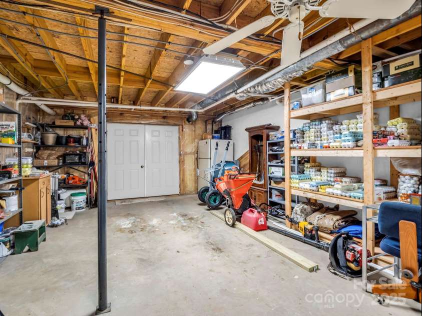 193 Downing Place, Lake Lure, NC 28746.  MLS# CAR4280208, YatesRealty ID 4203. Workshop, storage with double doors can accommodate extra storage and a golf cart.