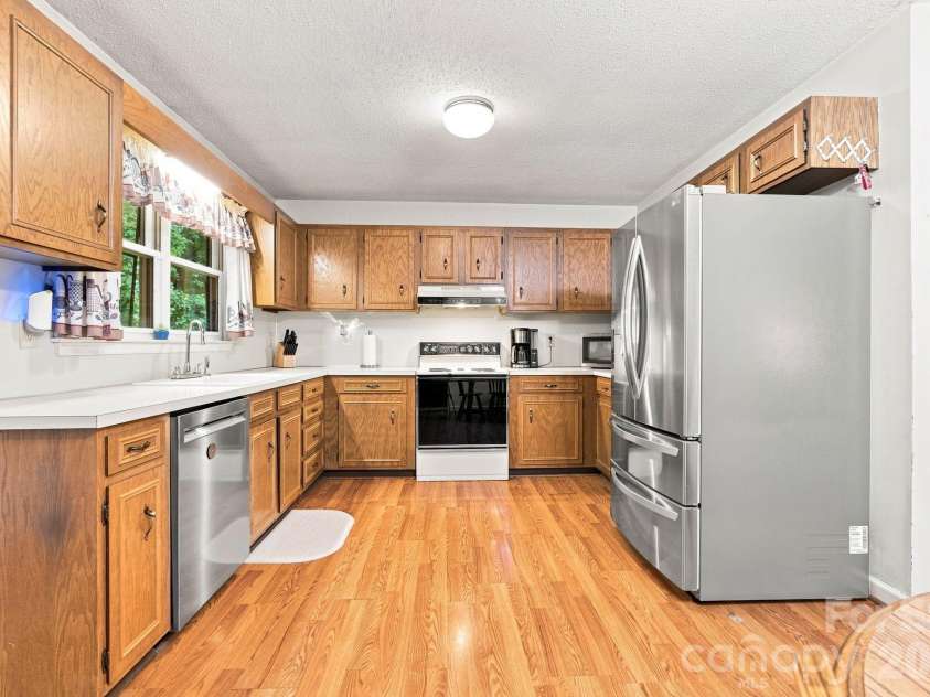 213 Hamilton Road, Troutman, NC 28166.  MLS# CAR4405468, YatesRealty ID 42054. Large kitchen with ample counter space and cabinets